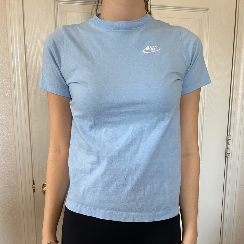 light blue/ baby blue Nike top with embroidered lettering size kids large